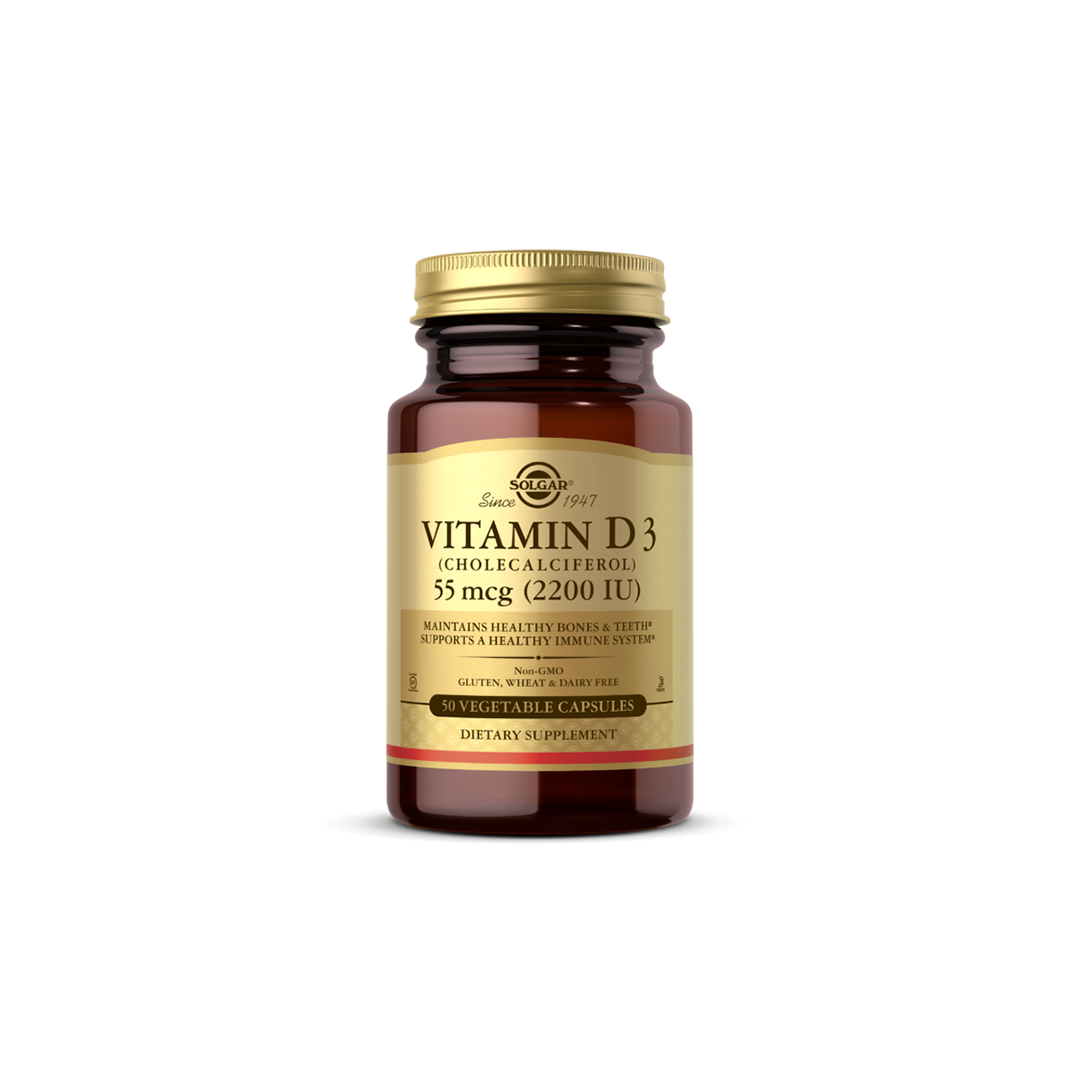 A brown bottle of Solgar's Vitamin D3 (Cholecalciferol) supplement features a gold label, providing 55 mcg (2200 IU) per capsule, and is formulated to support bone health. The package contains 50 vegetable capsules.