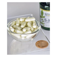 Thumbnail for A small glass bowl of white capsules is displayed next to a penny for scale, with a Swanson 5-HTP (Hydroxytryptophan) 50 mg supplement bottle in the background. These 60 capsules are known for aiding mood regulation and enhancing serotonin levels, inviting curiosity and promising balance.