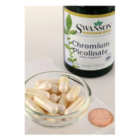 Thumbnail for A Swanson Chromium Picolinate 200 mcg 100 Capsules bottle, promoting heart health, stands in the background. In the foreground, a small glass bowl of capsules is placed beside a penny.