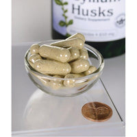 Miniatura per Un flacone di Swanson Psyllium Husks - 610 mg 300 capsule, una fibra solubile, con accanto un centesimo.