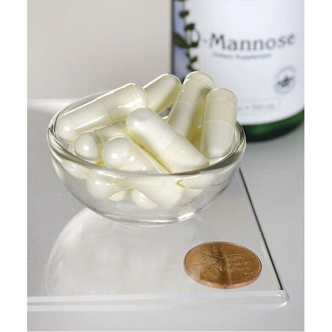 Una ciotola di vetro con dentro un flacone di Swanson D-Mannose - 700 mg 60 capsule.