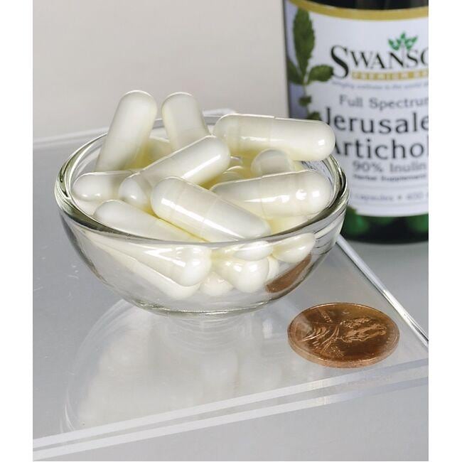 Una ciotola contenente Swanson's Prebiotic Jerusalem Artichoke - 400 mg 60 capsule, un integratore a base di erbe per la salute dell'apparato digerente.