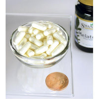 Miniatura per Una ciotola di Swanson Melatonina 3 mg 60 capsule accanto a un penny.