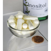 Miniatura di Swanson Inositol - 650 mg 100 capsule in una ciotola accanto a una bottiglia di Swanson Inositol.