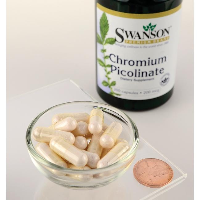 Una ciotola di Swanson Cromo picolinato - 200 mcg 200 capsule accanto a un centesimo.