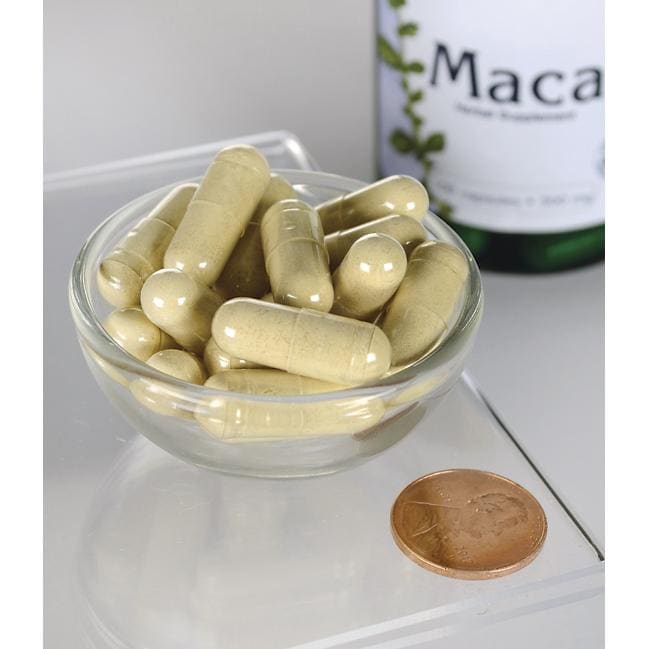Swanson Maca - 500 mg 100 capsule in una ciotola accanto a una bottiglia di Swanson Maca.
