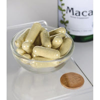 Miniatura di Swanson Maca - 500 mg 100 capsule in una ciotola accanto a una bottiglia di Swanson Maca.