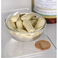 Miniatura per DGL Liquirizia deglicirrizzata - 750 mg 90 capsule di Swanson in una ciotola accanto a un centesimo.