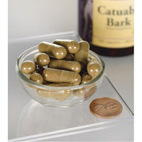 Miniatura di Swanson Catuaba Bark - 465 mg 120 capsule in una ciotola accanto a una bottiglia.