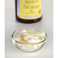 Miniatura di un flacone di Collagene Marino - 400 mg 60 capsule di Swanson accanto a una ciotola di vetro.