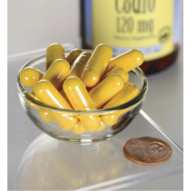 Swanson Coenzima Q10 - 120 mg 100 capsule in una ciotola di vetro accanto a una bottiglia.
