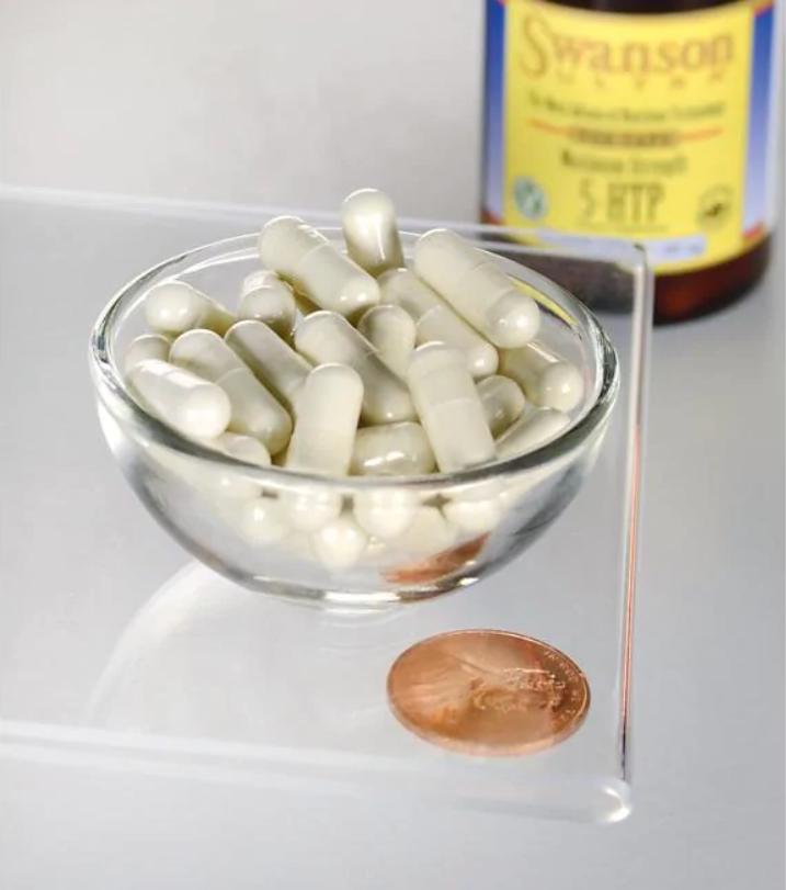 Una ciotola di Swanson 5-HTP Maximum Strength 200 mg 60 Capsule accanto a un centesimo.