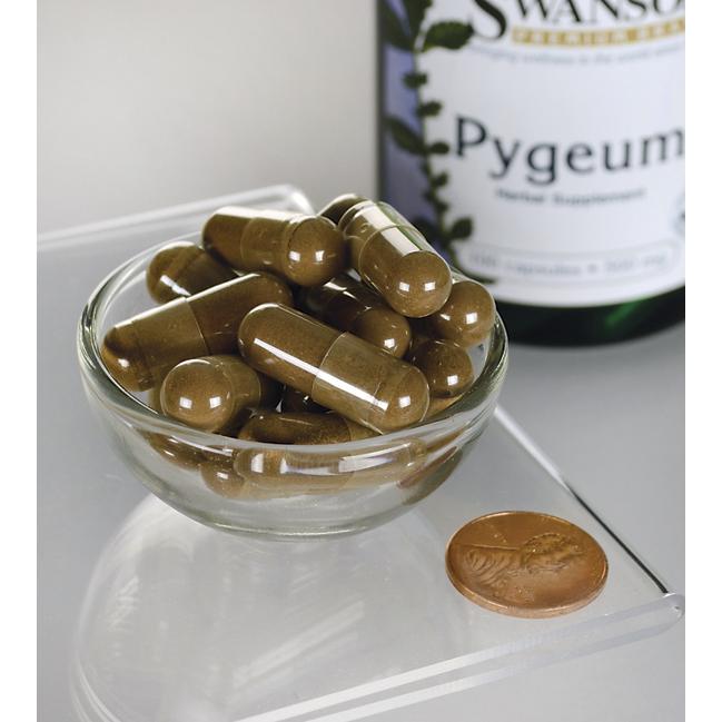 Swanson Pygeum - 500 mg 100 capsule in una ciotola accanto a una bottiglia di Swanson Pygeum per la salute della prostata.