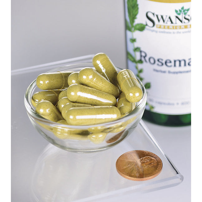 Una ciotola contenente un flacone di Swanson Rosemary - 400 mg 90 capsule, un'erba ricca di antiossidanti, e un centesimo.