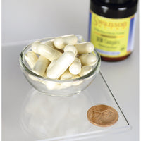 Miniatura di una ciotola di Swanson DIM Complex - 100 mg 30 capsule accanto a un centesimo.